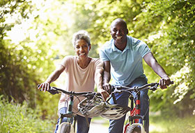 Man and woman riding bikes